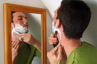 male shaving beard