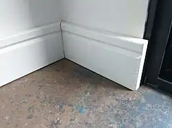 We made our own custom designed baseboards.