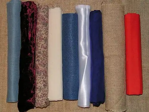 Variety of fabric. From the left: evenweave cotton, velvet, printed cotton, calico, felt, satin, silk, hessian, polycotton.