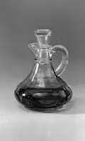 Cruet - a small container for the wine or water to be used in the celebration of the Eucharist