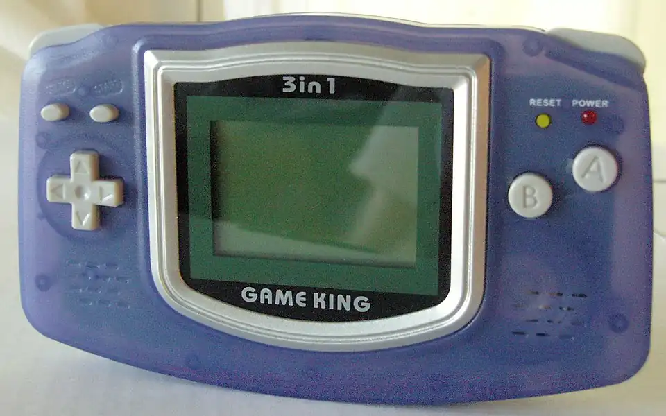 An original GameKing console that features a similar design to the Game Boy Advance.