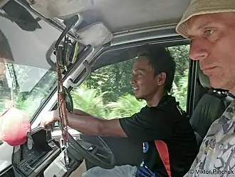 In the cab of a food truck (Malaysia). (Expedition to Papua New Guinea)