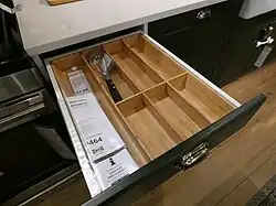 frameless base cabinet with open drawer