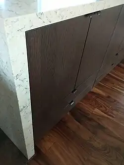 …and oak veneer for the cabinets that face the dining area.