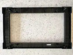 The frame (back side); it is part of the trim kit, too.