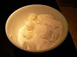 Cut shortening into dry ingredients