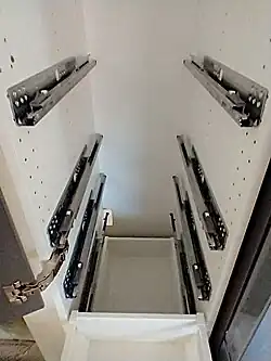 A number of installed slides, ready to receive drawers