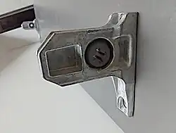 The brackets must go in this orientation, with the protruding part up and the flat end down.