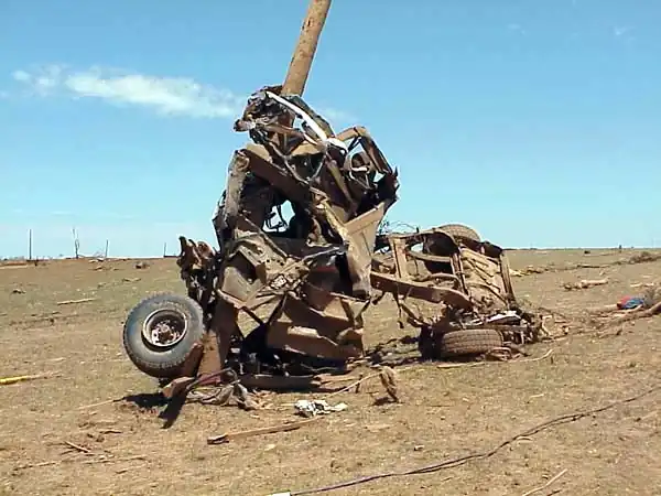 This truck has been wrapped around a pole by a tornado. Do not seek shelter in vehicles.