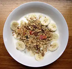 Bowl of muesli with milk and fruit