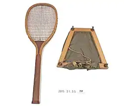 Wooden tennis racquet.