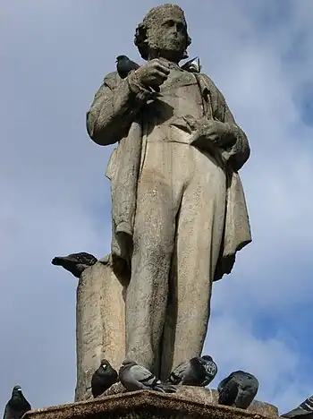 Richard Cobden Standing at the unfashionable end of Camden High Street is this distinctly careworn statue of Richard Cobden, seemingly noticed only by the pigeons. Cobden was a 19th century Manchester industrialist and MP who championed free trade and campaigned for the repeal of the corn laws. He later became a severe critic of what he saw as the militarism of British foreign policy and promoted better relations with France..