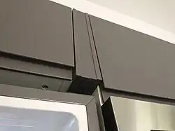 Notice that the bottom of the box shows, too (at least when the fridge door is being opened)