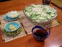 Somen with cucumbers, dipping sauce, and garnishes