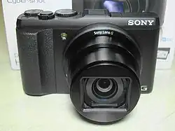 A small camera, which retracts the lens back into the body.