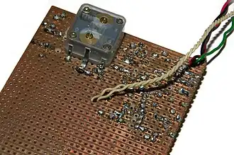 solder side of same AM receiver. DIP integrated circuits usually require traces to be cut between their 2 rows of pins