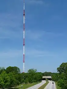 An antenna tower 1,075 feet (328&nbsp;m) tall in Atlanta, GA with its red and white aircraft warning paint visible