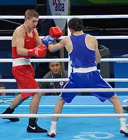 Виталий Дунайцев (в красном) против монгола Баатарсуха Чинзорига на Олимпиаде 2016 года в Рио-де-Жанейро.