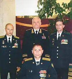 Стоят (слева направо): Р. В. Кокшин, В. Е. Проничев и С. А. Дементьев. А. В. Шалыгин (сидит)