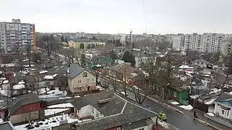 конец улицы — вид со стороны площади Пять угловна заднем плане комплекс зданий духовной семинарии (жёлтого цвета) и церковь Михаила и Фёдора