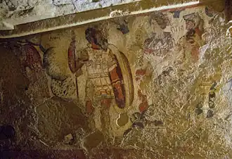 Фреска: Гадес («Айта», справа) и Персефона («Ферсипнея», в середине) возглавляют процессию.
(Гробница Оркуса II, Тарквиния, Италия)