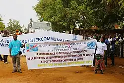 Граждане, марширующие в деревне Кибиризи, Мутанда группа, в вождестве Бвито