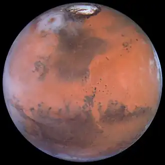 Ацидалийская равнина — тёмная область сверху. Снимок «Хаббла», 1999