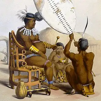 Инкоси Мпанде в окружении прислуги. Стул вырезан зулусскими мастерами из одного куска дерева. С рисунка Ангаса (ок. 1848 г.)