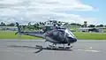 Вертолёт Eurocopter AS350 (DQ-HUG) вылетает из Международного аэропорта Нади (2017).