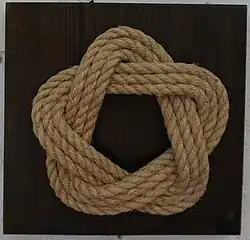 Лапчатка (узел).Мат из У. турецкая голова 2х5 в дисковой форме.