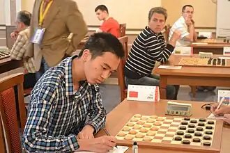 Чжоу Вэй на чемпионате мира по международным шашкам. Уфа, 2013