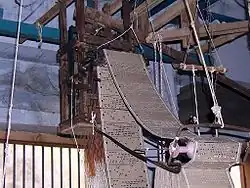 The Jacquard loom was developed in 1801. Note the wooden punch cards.