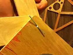 Photo 11:Pin bent out to hold parts in place.