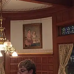 a painting of two little girls in the Mabel Tainter