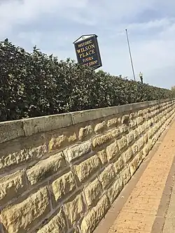 Sign in front of the Wilson Place museum, downtown Menomonie